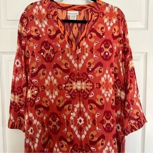 Tunic top,slipon. Abstract design in rich orange hues.Iridescent embellishments.